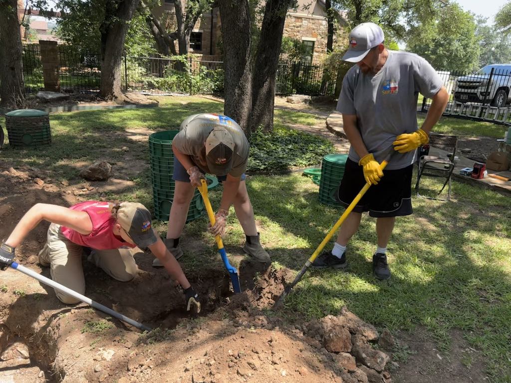 Best Texas Septic technicians digging to access a residential septic tank